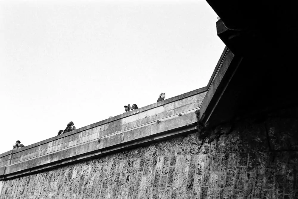 tourists on a bridge in paris