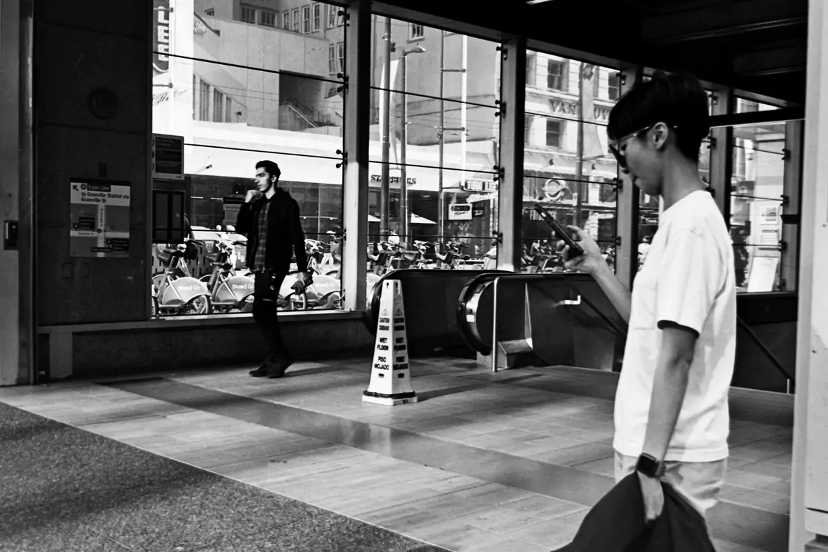 People in from of city center skytrain vancouver Analog Photography