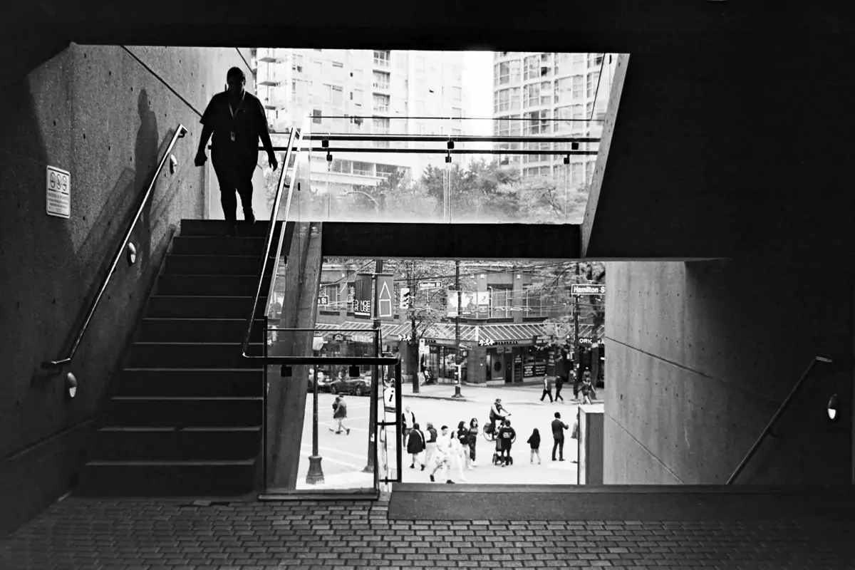 Woman walking in the stairs Vancouver Library Analog Photography