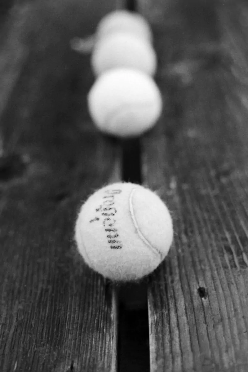 Tennis Balls on a Bench